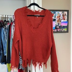 Red fringed sweater